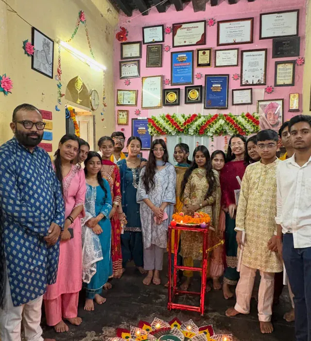 Vijay Kishor Tiwari with his students at a festival celebration at Vijay Classes, Janakpuri