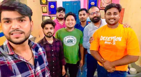 A selfie of Vijay Kishor Tiwari with a group of his students at the centre